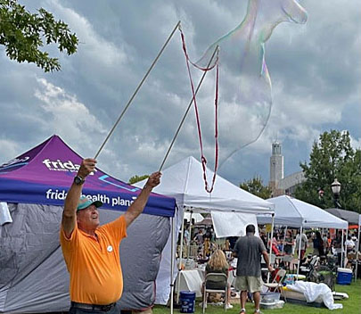 Man making giant bubbles